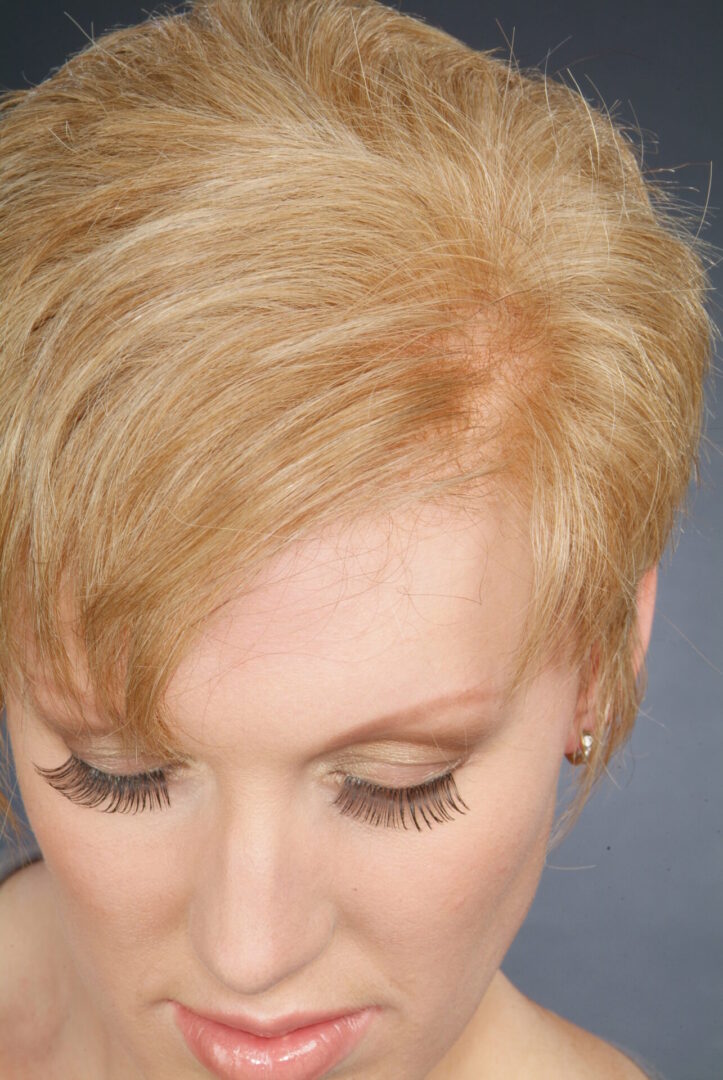 A Woman With Blond Hair Close Up View